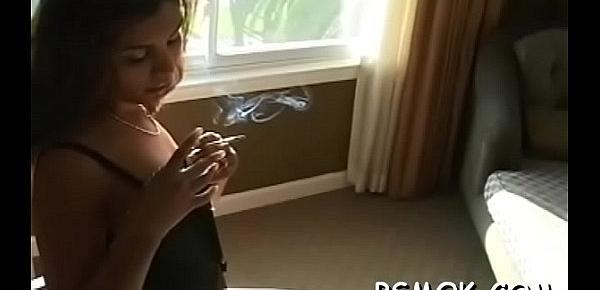  Gorgeous playgirl sucks a dick like a pro while smoking a cig